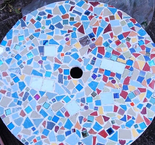 Garden table with mosaic from an old coil